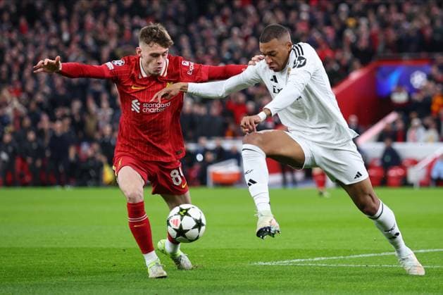 Liverpool FC v Real Madrid C.F. - UEFA Champions League 2024 25 League Phase MD5 Conor Bradley of Liverpool and Kylian Mbappe of Real Madrid CF challenge during the UEFA Champions League 2024 25 League Phase MD5 match between Liverpool FC and Real Madrid C.F. at Anfield on November 27, 2024 in Liverpool, England. Liverpool Anfield England United Kingdom Copyright: xedxSykes Sportsphoto APLx 14052898