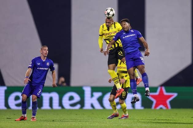GNK Dinamo v Borussia Dortmund - UEFA Champions League 2024 25 League Phase MD5 Donyell Malen of Borussia Dortmund competes for the ball with Ronael Pierre-Gabriel of Dinamo Zagreb during the UEFA Champions League 2024 25 League Phase MD5 match between GNK Dinamo Zagreb and Borussia Dortmund at Maksimir stadium on November 27, 2024 in Zagreb, Croatia.  LukaxStanzl PIXSELL