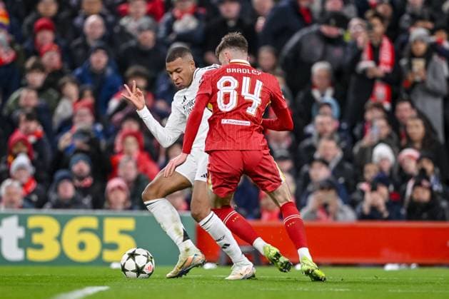 Kylian Mbappe (Real Madrid CF) und Conor Bradley (Liverpool FC) battle for the ball during the UEFA Champions League 2024 25 League Phase MD5 match between Liverpool FC and Real Madrid C.F. at Anfield on November 27, 2024 in Liverpool, England. Defodi-541_LIVREA20241127_038
