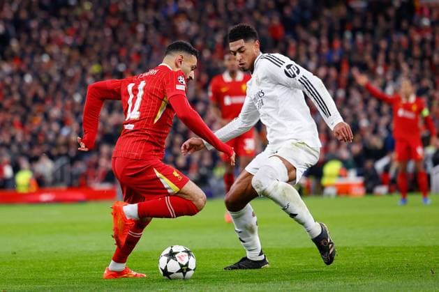 November 27, 2024, Liverpool, Liverpool, ENGLAND: Mohamed Salah of Liverpool and Jude Bellingham of Real Madrid in action during the UEFA Champions League 2024 25 League Phase MD5 match between Liverpool FC and Real Madrid CF at Anfield on November 27, 2024, in Liverpool, England. Liverpool ENGLAND - ZUMAa181 20241127_zaa_a181_057 Copyright: xDennisxAgyemanx
