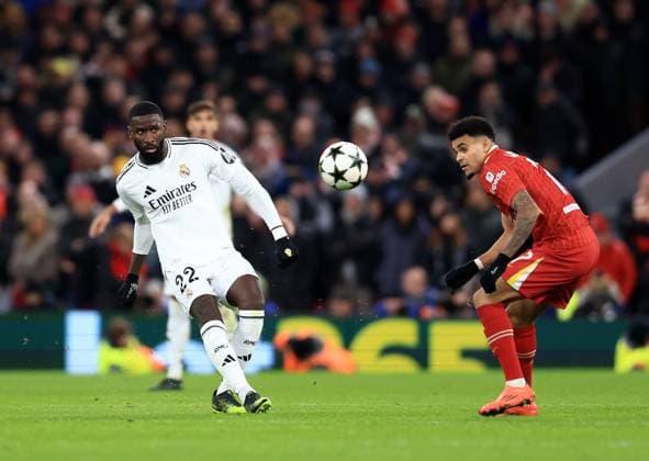 Liverpool, England, 27th November 2024. Liverpool™s Luis Diaz with Real Madrid™s Antonio Rudiger during the UEFA Champions League match at Anfield, Liverpool. Picture credit should read: Jessica Hornby Sportimage EDITORIAL USE ONLY. No use with unauthorised audio, video, data, fixture lists, club league logos or live services. Online in-match use limited to 120 images, no video emulation. No use in betting, games or single club league player publications. SPI-3486-0103