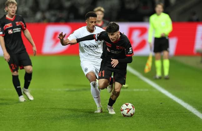 28.11.2024, Fussball UEFA Europa League, FC Midtjylland - Eintracht Frankfurt, emonline, emspor, v.l., Tuta Lucas Silva Melo (Eintracht Frankfurt), Mikel Krüger-Johnson (FC Midtjylland) DFL DFB REGULATIONS PROHIBIT ANY USE OF PHOTOGRAPHS AS IMAGE SEQUENCES AND OR QUASI-VIDEO. xdcx Copyright: HMBxMedia Claus
