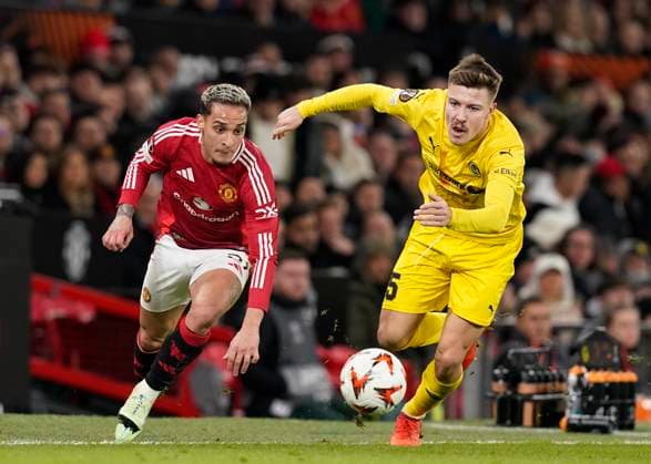 Manchester, England, 28th November 2024. Antony of Manchester United, ManU tussles with Fredrik Andre Bjorkan of FK Bodo Glimt during the UEFA Europa League match at Old Trafford, Manchester. Picture credit should read: Andrew Yates Sportimage EDITORIAL USE ONLY. No use with unauthorised audio, video, data, fixture lists, club league logos or live services. Online in-match use limited to 120 images, no video emulation. No use in betting, games or single club league player publications. SPI-3487-0057