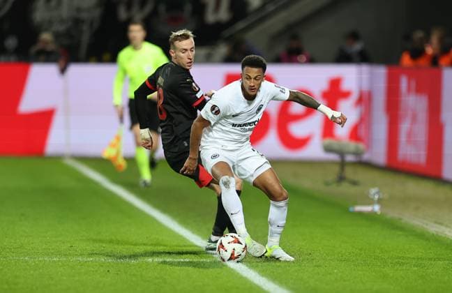 28.11.2024, Fussball UEFA Europa League, FC Midtjylland - Eintracht Frankfurt, emonline, emspor, v.l., Adam Buksa (FC Midtjylland), Tuta Lucas Silva Melo (Eintracht Frankfurt) DFL DFB REGULATIONS PROHIBIT ANY USE OF PHOTOGRAPHS AS IMAGE SEQUENCES AND OR QUASI-VIDEO. xdcx Copyright: HMBxMedia Claus
