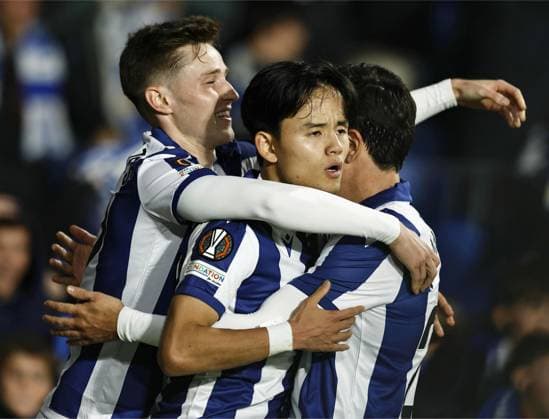 Football: UEFA Europa League Real Sociedad s Takefusa Kubo (C) celebrates with teammates after scoring in the second half of a UEFA Europa League football match against Ajax in San Sebastian, Spain, on Nov. 28, 2024.  A14AA0003794323P