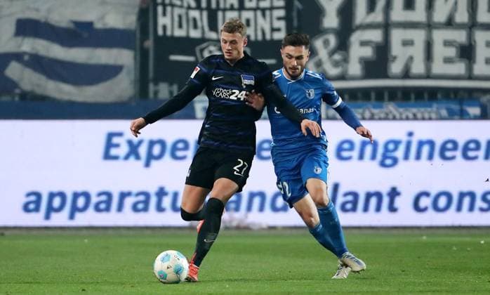 Michael Cuisance am Ball, Samuel Loric Zweikampf Spielszene Aktion Fußball Fussball 2.Bundesliga Herren 14. Spieltag Saison 2024 2025 29.11.2024 1.FC Magdeburg FCM vs. Hertha BSC Berlin DFL regulations prohibit any use of photographs as image sequences and or quasi-video.