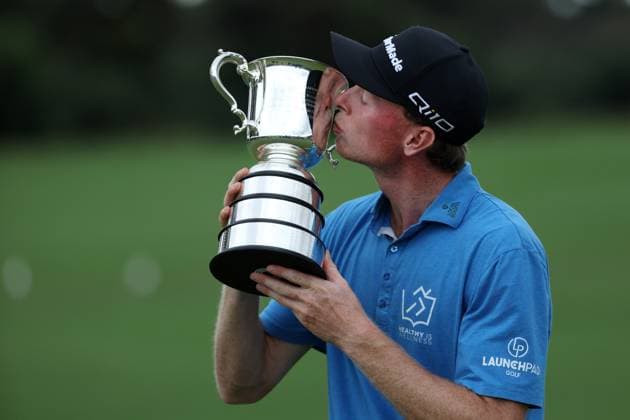 GOLF AUSTRALIAN OPEN, Ryggs Johnston poses for a photo with the winners trophy at the conclusion of day four of the ISPS HANDA Australian Open at Kingston Heath Golf Club in Melbourne, Sunday, December 1, 2024. ( NO ARCHIVING, EDITORIAL USE ONLY, NO USE IN BOOKS WITHOUT CONSENT MELBOURNE VICTORIA AUSTRALIA  Copyright: xCONxCHRONISx 20241201181947875147