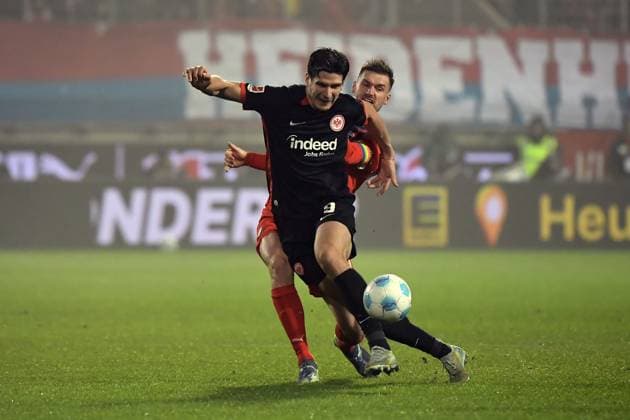 01.12.2024, xemx, Fussball 1.Bundesliga, 1.FC Heidenheim - Eintracht Frankfurt emspor, v.l. Igor Matanovic (Eintracht Frankfurt) Patrick Mainka (1.FC Heidenheim) Zweikampf, Aktion, action, battle for the ball (DFL DFB REGULATIONS PROHIBIT ANY USE OF PHOTOGRAPHS as IMAGE SEQUENCES and or QUASI-VIDEO) Heidenheim