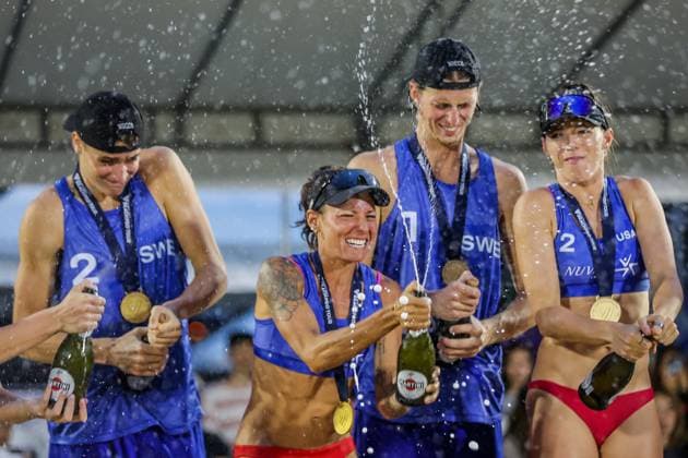 (241202) -- LAGUNA PROVINCE, Dec. 2, 2024 -- Women s match gold medalists Molly Shaw(2nd L) Toni Rodriguez (1st R)of the United States and men s match gold medalists Elmer Andersson(2nd R) Jacob Holting Nilsson of Sweden celebrate during the awarding ceremony at the 2024 Volleyball World Beach Pro Tour Challenge in Laguna Province, the Philippines on Dec. 1, 2024. ) (SP)PHILIPPINES-LAGUNA PROVINCE-VOLLEYBALL WORLD BEACH PRO TOUR CHALLENGE ROUELLExUMALI 