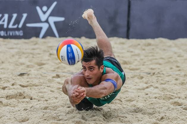 (241202) -- LAGUNA PROVINCE, Dec. 2, 2024 -- Javier Bello of England tries to save the ball during the Men s 3rd place match between Javier Bello Joaquin Bello of England and Philipp Waller Timo Hammarberg of Germany at the 2024 Volleyball World Beach Pro Tour Challenge in Laguna Province, the Philippines on Dec. 1, 2024. ) (SP)PHILIPPINES-LAGUNA PROVINCE-VOLLEYBALL WORLD BEACH PRO TOUR CHALLENGE ROUELLExUMALI 