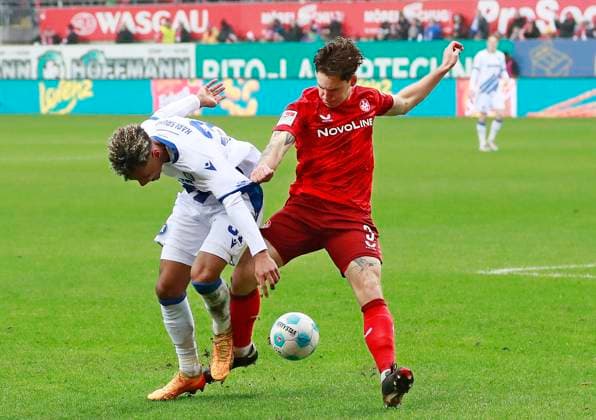 07.12.2024, xmohx, Fussball 2.Bundesliga, 1.FC Kaiserslautern - Karlsruher SC emspor, v.l. BambasÃ ContÃ (Karlsruhe), Florian Kleinhansl (Kaiserslautern) (DFL DFB REGULATIONS PROHIBIT ANY USE OF PHOTOGRAPHS as IMAGE SEQUENCES and or QUASI-VIDEO) Kaiserslautern