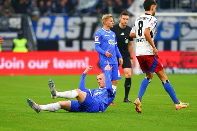 GER,Hamburg, Fussball, DFB, Hamburger SV vs SV Darmstadt 98 , im Hamburger Volksparkstadion , 08.12.2024 , v.l. Isac Lidberg ( SV Darmstadt 98 ) liegt auf dem Boden DFL regulations prohibit any use of photographs as image sequences and or quasi-video.