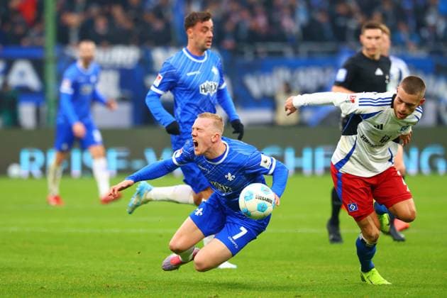 GER,Hamburg, Fussball, DFB, Hamburger SV vs SV Darmstadt 98 , im Hamburger Volksparkstadion , 08.12.2024 , v.l. Isac Lidberg ( SV Darmstadt 98 ) wirde gefault von Miro Muheim (Hamburger SV) DFL regulations prohibit any use of photographs as image sequences and or quasi-video.