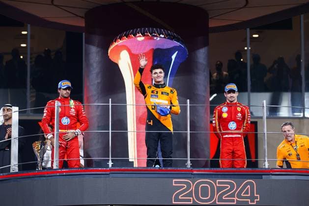 December 8, 2024, Abu Dhabi, United Arab Emirates: Lando Norris of McLaren, Carlos Sainz of Ferrari and Charles Leclerc of Ferrari celebrate on the podium during Formula 1 Abu Dhabi Grand Prix at Yas Marina Circuit on December 8th, 2024 in Abu Dhabi, United Arab Emirates. Abu Dhabi United Arab Emirates - ZUMAz156 0783737542st Copyright: xBeataxZawrzelx