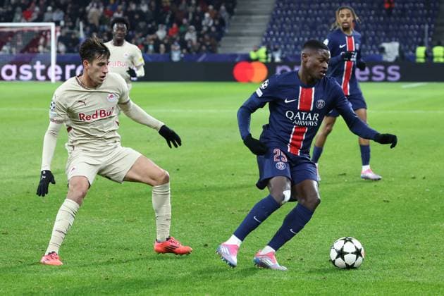 SOCCER - UEFA CL, RBS vs PSG SALZBURG,AUSTRIA,10.DEC.24 - SOCCER - UEFA Champions League, Red Bull Salzburg vs Paris Saint German. Image shows Nicolas Capaldo (RBS) and Nuno Mendes (PSG).  GEPAxpictures xDavidxGeieregger