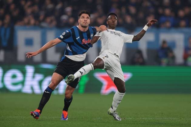 Bergamo, Italy, 10th December 2024. Berat Djimsiti of Atalanta anticipates Vinicius Junior of Real Madrid to head thew ball clear during the UEFA Champions League match at Stadio di Bergamo, Bergamo. Picture credit should read: Jonathan Moscrop Sportimage EDITORIAL USE ONLY. No use with unauthorised audio, video, data, fixture lists, club league logos or live services. Online in-match use limited to 120 images, no video emulation. No use in betting, games or single club league player publications. SPI-3516-0009