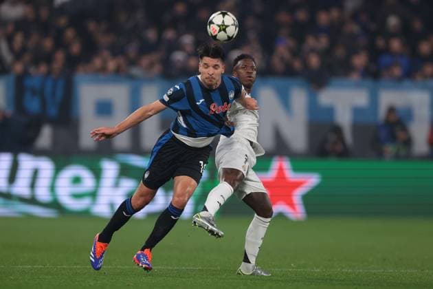 Bergamo, Italy, 10th December 2024. Berat Djimsiti of Atalanta anticipates Vinicius Junior of Real Madrid to head thew ball clear during the UEFA Champions League match at Stadio di Bergamo, Bergamo. Picture credit should read: Jonathan Moscrop Sportimage EDITORIAL USE ONLY. No use with unauthorised audio, video, data, fixture lists, club league logos or live services. Online in-match use limited to 120 images, no video emulation. No use in betting, games or single club league player publications. SPI-3516-0010