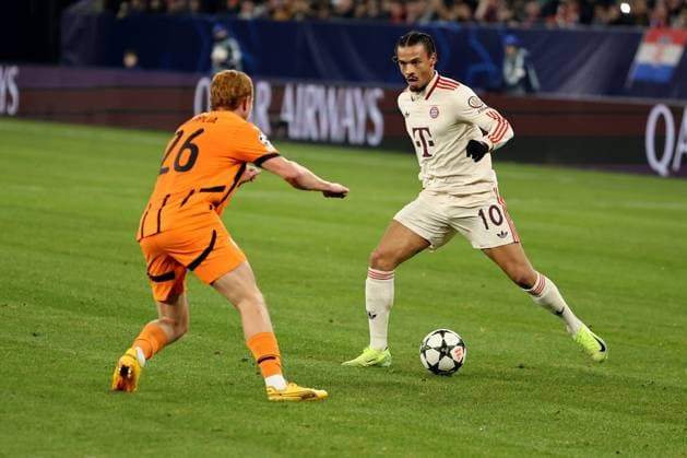 Yukhym Konoplya (Shakhtar Donetsk) und Leroy Sane (FC Bayern München) beim Spiel der Champions League (Saison 2024 25) Schachtar Donezk - FC Bayern München Copyright: Thomas Pakusch