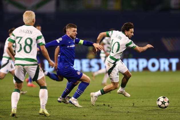 Zagreb, 10.12.2024. - Maksimir Stadium, UEFA CHAMPIONS LEAGUE - 2024 25, League phase, Matchday 6, GNK Dinamo - Celtic. Stefan Ristovski (22) and Nicolas Kühn (10) 