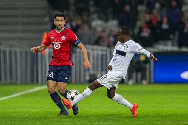 SOCCER - UEFA CL, Lille vs Sturm LILLE,FRANCE,11.DEC.24 - SOCCER - UEFA Champions League, OSC Lille vs SK Sturm Graz. Image shows Benjamin Andre (Lille) and Malick Yalcouye (Sturm).  GEPAxpictures xAvnixRetkoceri
