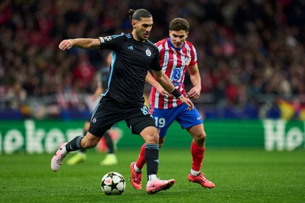 Kyriakos Savvidis of SK Slovan Bratislava and Julian Alvarez of Atletico de Madrid Atletico de Madrid v Slovan Bratislava. UEFA Champions League match. Date 6. Football, Riyadh Air Metropolitano Stadium, Madrid, Spain - 11 Dic 2024 Editorial use only  Copyright: xPRESSINPHOTO Shutterstockx 14994194e