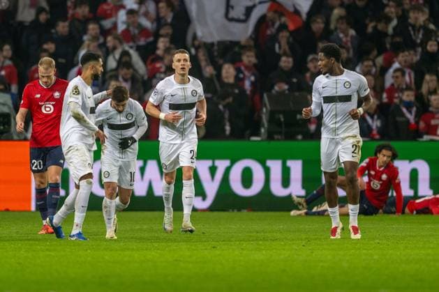 SOCCER - UEFA CL, Lille vs Sturm LILLE,FRANCE,11.DEC.24 - SOCCER - UEFA Champions League, OSC Lille vs SK Sturm Graz. Image shows the rejoicing of Sturm with Gregory Wuethrich, Otar Kiteishvili, Dimitri Lavalee and Tochi Chukwuani (Sturm).  GEPAxpictures xAvnixRetkoceri