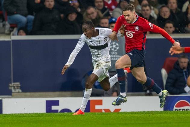 SOCCER - UEFA CL, Lille vs Sturm LILLE,FRANCE,11.DEC.24 - SOCCER - UEFA Champions League, OSC Lille vs SK Sturm Graz. Image shows Malick Yalcouye (Sturm) and Gabriel Gudmundsson (Lille).  GEPAxpictures xAvnixRetkoceri