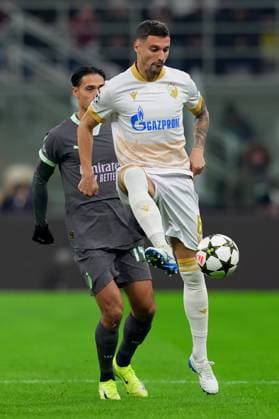 AC Milan s Tijjani Reijnders fight for the ball with Red Star s Rade Krunic during the Uefa Champions League soccer match between Ac Milan and Crvena Zvezda at the San Siro Stadium in Milan, north Italy - Wednesday , December 11, 2024. - Soccer .  Copyright: xSpada LaPressex