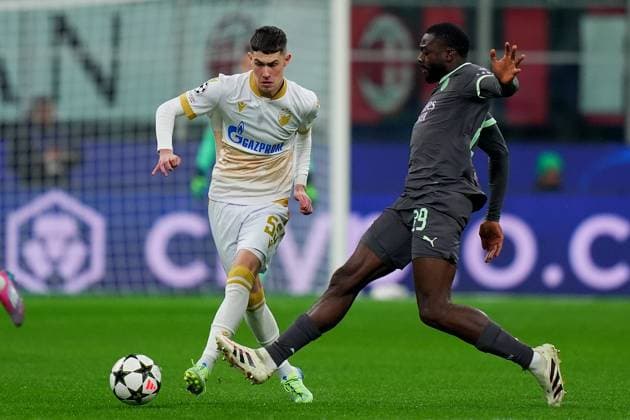Red Star s Andrija Maksimovic fight for the ball with AC Milan s Youssouf Fofana .during the Uefa Champions League soccer match between Ac Milan and Crvena Zvezda at the San Siro Stadium in Milan, north Italy - Wednesday , December 11, 2024. - Soccer .  Copyright: xSpada LaPressex
