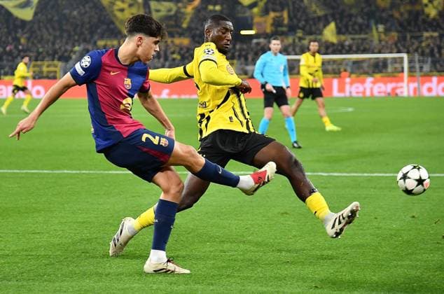 11.12.2024, xhbx, Fussball UEFA Champions League, Borussia Dortmund - FC Barcelona, Barca emspor, v.l. Pau Cubarsi (FC Barcelona), Serhou Guirassy (Borussia Dortmund) (DFL DFB REGULATIONS PROHIBIT ANY USE OF PHOTOGRAPHS as IMAGE SEQUENCES and or QUASI-VIDEO) Dortmund