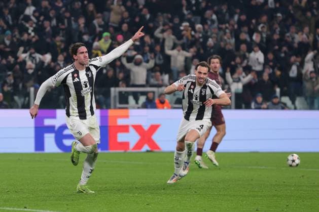 Turin, Italy, 11th December 2024. Dusan Vlahovic of Juventus celebrates with team mates after scoring to give the side a 1-0 lead during the UEFA Champions League match at Juventus Stadium, Turin. Picture credit should read: Jonathan Moscrop Sportimage EDITORIAL USE ONLY. No use with unauthorised audio, video, data, fixture lists, club league logos or live services. Online in-match use limited to 120 images, no video emulation. No use in betting, games or single club league player publications. SPI-3517-0008