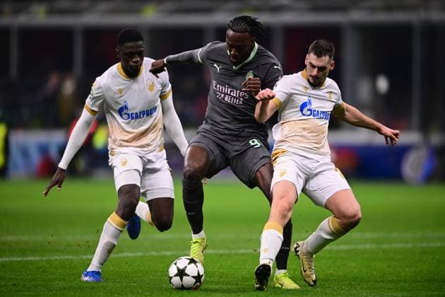 AC Milan v FK Crvena Zvezda - UEFA Champions League 2024 25 League Phase MD6 Tammy Abraham of AC Milan and Ivan Gutesa of FK Crvena Zvezda battle for the ball during the UEFA Champions League match between AC Milan and FK Crvena Zvezda at Giuseppe Meazza in Milan, Italy, on December 11, 2024. Milan Italy  Copyright: xAndreaxDiodatox originalFilename:diodato-acmilanv241211_npOKV.jpg