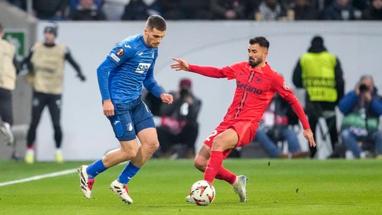 v.li.: David Jurasek (Hoffenheim, 19), Valentin Cretu (FCSB Bukarest, 2), Zweikampf, Spielszene, Duell, duel, tackle, tackling, Dynamik, Action, Aktion, 12.12.2024, Sinsheim (Deutschland), Fussball, UEFA Europa League, Gruppenphase, TSG 1899 Hoffenheim - FCSB Bukarest, REGULATIONS PROHIBIT ANY USE OF PHOTOGRAPHS AS IMAGE SEQUENCES AND OR QUASI-VIDEO.
