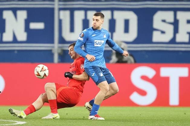 12.12.2024, xtvx, Fussball UEFA Europa League, TSG 1899 Hoffenheim - FCSB Bukarest emspor, v.l. Zweikampf, Duell, duel, tackle, compete Daniel Popa (FC Steaua Bukarest) David Jurasek (TSG 1899 Hoffenheim) (DFL DFB REGULATIONS PROHIBIT ANY USE OF PHOTOGRAPHS as IMAGE SEQUENCES and or QUASI-VIDEO) Sinsheim