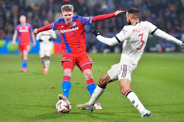 Pavel Sulc of Plzen, left, and Noussair Mazraoui of Manchester in action during the football Europa League 6th round match Viktoria Plzen vs Manchester United, ManU in Pilsen, Czech Republic, December 12, 2024. (CTKxPhoto MiroslavxChaloupka) CTKPhotoP2024121207587  CTKPhotoP2024121207587