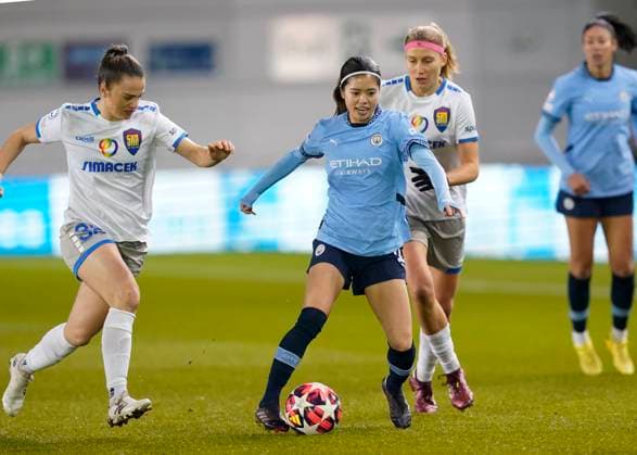 Manchester, England, 12th December 2024. Yui Hasegawa of Manchester City challenged by Melike Pektackled by ~wel during the UEFA Womens Champions League match at the Academy Stadium, Manchester. Picture credit should read: Andrew Yates Sportimage EDITORIAL USE ONLY. No use with unauthorised audio, video, data, fixture lists, club league logos or live services. Online in-match use limited to 120 images, no video emulation. No use in betting, games or single club league player publications. SPI-3522-0002