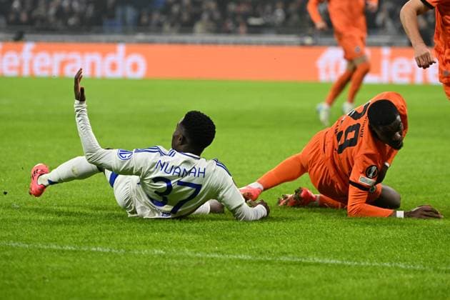 12.12.2024, xjhx, Fussball UEFA Europa League, Olympique Lyon - Eintracht Frankfurt emspor, v.l. Foul von Niels Nkounkou (Eintracht Frankfurt) an Ernest Nuamah (Olympique Lyon) Zweikampf, Aktion, action, battle for the ball (DFL DFB REGULATIONS PROHIBIT ANY USE OF PHOTOGRAPHS as IMAGE SEQUENCES and or QUASI-VIDEO) Lyon