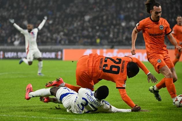 12.12.2024, xjhx, Fussball UEFA Europa League, Olympique Lyon - Eintracht Frankfurt emspor, v.l. Foul von Niels Nkounkou (Eintracht Frankfurt) an Ernest Nuamah (Olympique Lyon) Zweikampf, Aktion, action, battle for the ball (DFL DFB REGULATIONS PROHIBIT ANY USE OF PHOTOGRAPHS as IMAGE SEQUENCES and or QUASI-VIDEO) Lyon
