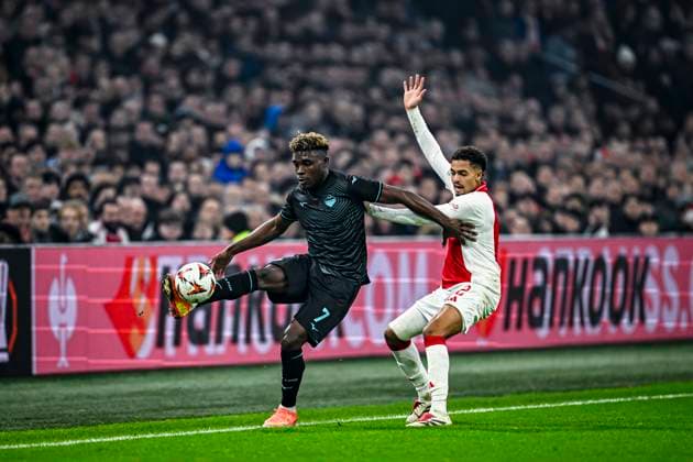 Lazio midfielder Fisayo Dele-Bashiru, AFC Ajax Amsterdam defender Devyne Rensch, during the match Ajax - Lazio at the Johan Cruijff ArenA for the UEFA Europa League - League phase - Matchday 6 season 2024-2025 in AMSTERDAM, Netherlands on 12 december 2024, (photo by Stefan Koops EYE4images DeFodi Images) Defodi-746_203900