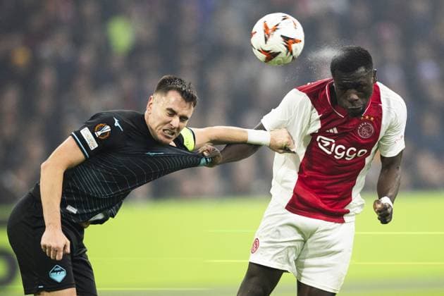 AMSTERDAM - (l-r) Patric of SS Lazio, Brian Brobbey of Ajax during the UEFA Europa League match between AFC Ajax Amsterdam and SS Lazio Roma at the Johan Cruijff ArenA on Dec. 12, 2024 in Amsterdam, Netherlands. ANP KOEN VAN WEEL UEFA Europa League 2024 25 League Phase MD6 2024 25 xVIxANPxSportx xxANPxIVx 515559311 originalFilename: 515559311.jpg