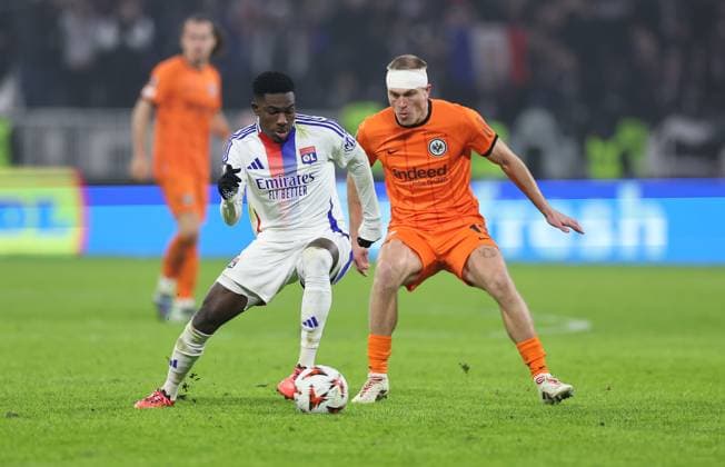 12.12.2024, Fussball UEFA Europa League, Olympique Lyon - Eintracht Frankfurt, emonline, emspor, v.l., Ernest Nuamah (Olympique Lyon), Rasmus Kristensen (Eintracht Frankfurt) DFL DFB REGULATIONS PROHIBIT ANY USE OF PHOTOGRAPHS AS IMAGE SEQUENCES AND OR QUASI-VIDEO. xdcx Copyright: HMBxMedia Claus