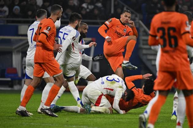 12.12.2024, xjhx, Fussball UEFA Europa League, Olympique Lyon - Eintracht Frankfurt emspor, v.l. Nicolas Tagliafico (Olympique Lyon) Hugo Ekitike (Eintracht Frankfurt) Mahmoud Dahoud (Eintracht Frankfurt) Zweikampf, Aktion, action, battle for the ball (DFL DFB REGULATIONS PROHIBIT ANY USE OF PHOTOGRAPHS as IMAGE SEQUENCES and or QUASI-VIDEO) Lyon