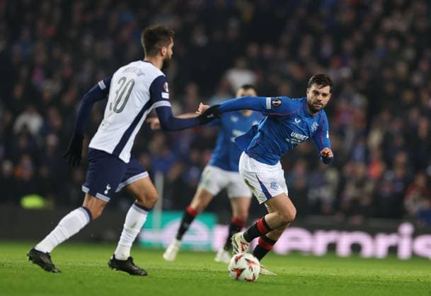Rodrigo Bentancur of Tottenham Hotspur and Robin Propper of Rangers during the Europa League group phase match at Ibrox Stadium, Glasgow. Rangers v Tottenham Hotspur, UEFA Europa League, Football, Ibrox Stadium, Glasgow, Scotland, UK - 12 Dec 2024 EDITORIAL USE ONLY No use with unauthorised audio, video, data, fixture lists, club league logos or live services. Online in-match use limited to 120 images, no video emulation. No use in betting, games or single club league player publications. Copyright: xKirkxO Rourke RangersxFC Shutterstockx 14998166ce