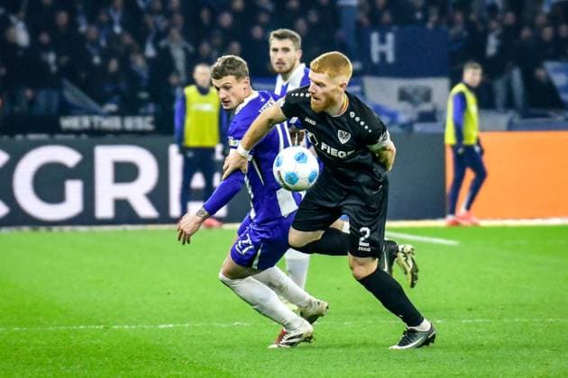 Fussball - 2.Bundesliga Hertha BSC Berlin - Preußen Münster 13.12.2024, xdanx, Fussball - 2.Bundesliga Hertha BSC Berlin - Preußen Münster v.l.Michael Cuisance (Hertha BSC 27),Mikkel Kirkeskov (SC Preußen Muenster 2),Zweikampf, Duell, Kampf, tackle (DFL DFB REGULATIONS PROHIBIT ANY USE OF PHOTOGRAPHS as IMAGE SEQUENCES and or QUASI-VIDEO) Daniel Lakomski Mix1 Berlin Olympiastadion Berlin Berlin Deutschland (DE)
