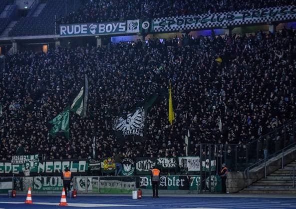 Fussball - 2.Bundesliga Hertha BSC Berlin - Preußen Münster 13.12.2024, xdanx, Fussball - 2.Bundesliga Hertha BSC Berlin - Preußen Münster v.l.Fans, Stimmung, Schals, Fahnen, Besucher, Trikots, Ultras, Preussen Muenster (DFL DFB REGULATIONS PROHIBIT ANY USE OF PHOTOGRAPHS as IMAGE SEQUENCES and or QUASI-VIDEO) Daniel Lakomski Mix1 Berlin Olympiastadion Berlin Berlin Deutschland (DE)