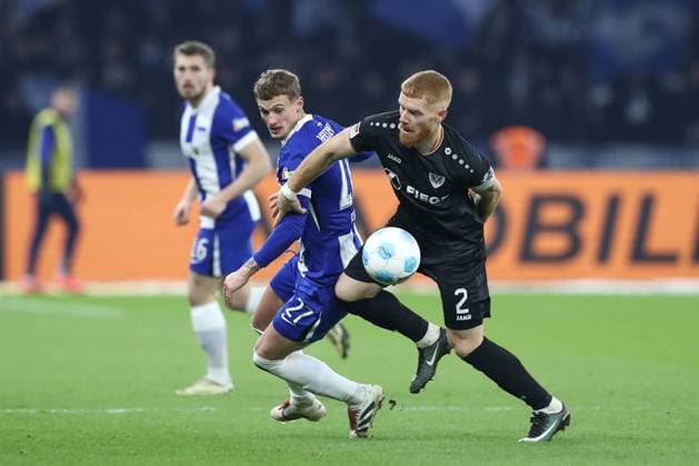 13.12.2024, xtgx, Fussball 2. Bundesliga, Hertha BSC Berlin - SC Preussen Muenster emspor, v.l. Michael Cuisance (Hertha, 27), Mikkel Kirkesov (Münster, 2) (DFL DFB REGULATIONS PROHIBIT ANY USE OF PHOTOGRAPHS as IMAGE SEQUENCES and or QUASI-VIDEO) Berlin
