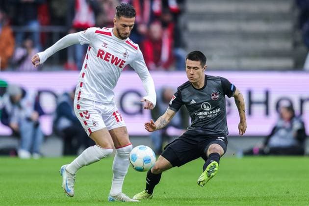 Fußball 2. Bundesliga 16. Spieltag 1. FC Köln - 1. FC Nürnberg am 15.12.2024 im RheinEnergieStadion in Köln Leart Pacarada ( Köln ), links - Oliver Villadsen ( Nürnberg ), rechts DFL regulations prohibit any use of photographs as image sequences and or quasi-video.