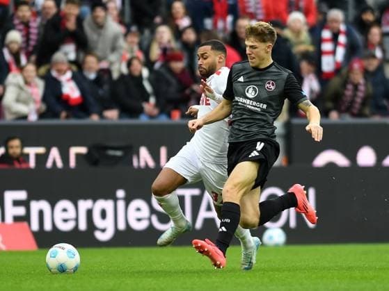 Linton Maina (1. FC Koeln) und Finn Jeltsch (1. FC Nuernberg) im Zweikampf waehrend des Spiels der 2. Bundesliga zwischen dem 1. FC Köln und 1. FC Nürnberg im RheinEnergieStadion am 15. December 2024 in Köln, Deutschland. (Foto von Ralf Treese DeFodi Images) +++ Linton Maina (1. FC Koeln) und Finn Jeltsch (1. FC Nuernberg) battle for the ball during the 2. Bundesliga match between 1. FC Köln and 1. FC Nürnberg at RheinEnergieStadion on December 15, 2024 in Cologne, Germany. (Photo by Ralf Treese DeFodi Images) DFB DFL REGULATIONS PROHIBIT ANY USE OF PHOTOGRAPHS AS IMAGE SEQUENCES AND OR QUASI-VIDEO. Defodi-521_KOEFCN20241215_010