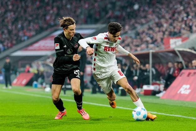 2. Fußball Bundesliga: 1. FC Köln - 1. FC Nürnberg; 15.12.2024 Zweikampf Caspar Jander (1. FC Nürnberg, 20), Denis Huseinbasic (1. FC Köln, 8) 2. Fußball Bundesliga: 1. FC Köln - 1. FC Nürnberg, Köln, Rheinenergiestadion am 15.12.2024 DFL REGULATIONS PROHIBIT ANY USE OF PHOTOGRAPHS AS IMAGE SEQUENCES AND OR QUASI-VIDEO.