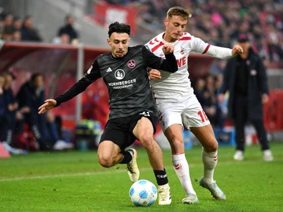 Berkay Yilmaz (1. FC Nuernberg) und Marvin Obuz (1. FC Koeln) im Zweikampf waehrend des Spiels der 2. Bundesliga zwischen dem 1. FC Köln und 1. FC Nürnberg im RheinEnergieStadion am 15. December 2024 in Köln, Deutschland. (Foto von Ralf Treese DeFodi Images) +++ Berkay Yilmaz (1. FC Nuernberg) und Marvin Obuz (1. FC Koeln) battle for the ball during the 2. Bundesliga match between 1. FC Köln and 1. FC Nürnberg at RheinEnergieStadion on December 15, 2024 in Cologne, Germany. (Photo by Ralf Treese DeFodi Images) DFB DFL REGULATIONS PROHIBIT ANY USE OF PHOTOGRAPHS AS IMAGE SEQUENCES AND OR QUASI-VIDEO. Defodi-521_KOEFCN20241215_045